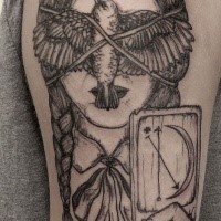 Black ink illustrative style shoulder tattoo of woman face with tied bird and card