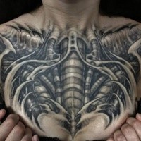 Black ink large chest tattoo of biomechanical organism