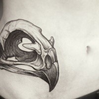 Black ink linework style animal skull tattoo on waist