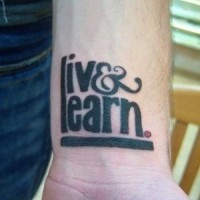 Black ink live learn wrist tattoo