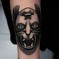 Black ink mystical looking arm tattoo of half human half lion face