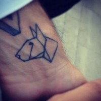 Black ink origami dog tattoo on wrist