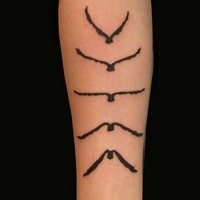 Black ink phases of flight bird tattoo on forearm