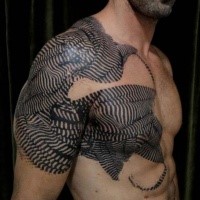 Black ink shoulder and chest tattoo of various ornaments