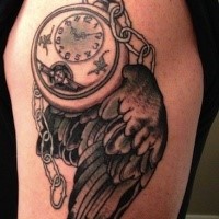 Black ink shoulder tattoo of bird wing with chained clock