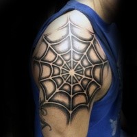 Black ink shoulder tattoo of detailed spider web