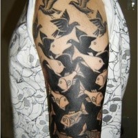 Black ink shoulder tattoo of fish with birds