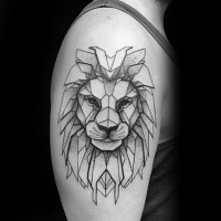 Black ink shoulder tattoo of lion head