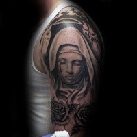 Black ink shoulder tattoo of saint woman with roses