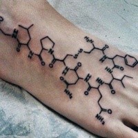 Black ink simple looking chemistry formula tattoo on foot