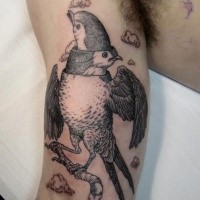 Black ink surrealism style biceps tattoo of interesting looking bird