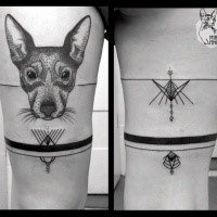 Black ink thigh tattoo of cute dogs face with ornaments