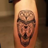 Black ink totem owl tattoo on leg