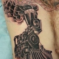 Black ink train tattoo painted in old school style on belly