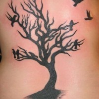 Black ink tree and birds tattoo on back
