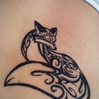 Black ink tribal fox tattoo