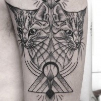 Black ink typical shoulder tattoo of mirrored cats