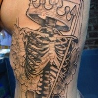 Black ink unfinished large side tattoo of human skeleton with crown and flowers