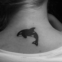 Black killer whale tattoo on neck