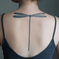 Black minimalist dragonfly tattoo on back for girls