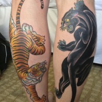 Tatuaggio sulle gambe la pantera nera & la tigre feroce
