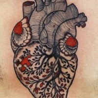 Black red tree turns into a heart tattoo