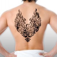 Black tribal phoenix tattoo on back for men