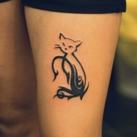 Black tribal style cat tattoo on thigh