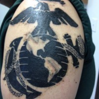 Black usmc military tattoo on shoulder