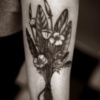 Black wildflowers forearm tattoo by Alice Carrier