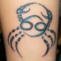 Black with blue crab tattoo on arm