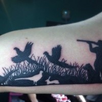 Blackwork style big arm tattoo of hunter shooting ducks