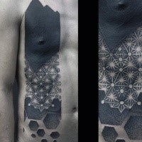Blackwork style big chest tattoo of various ornaments