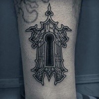 Blackwork style big leg tattoo of creepy key