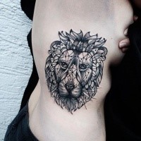 Blackwork style big side tattoo of lion head with various figures