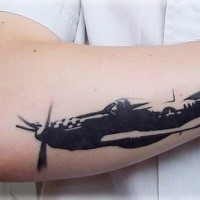 Blackwork style detailed arm tattoo of WW2 fighter plane