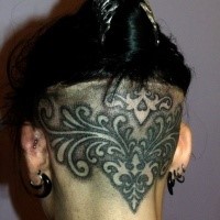 Blackwork style detailed head tattoo of interesting ornament