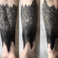 Blackwork style forearm tattoo of mountains with trees