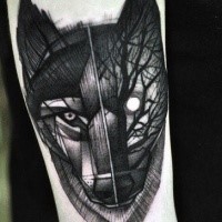 Blackwork style forearm tattoo of mystical wolf