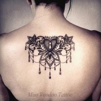 Blackwork style impressive looking upper back tattoo of heart shaped lock with flowers by Caro Voodoo