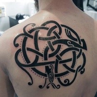 Blackwork style interesting looking back tattoo of small snake
