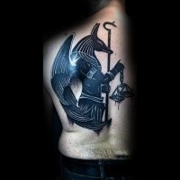 Blackwork style large back tattoo of Anubis God