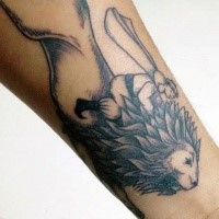 Blackwork style leg tattoo of man riding lion