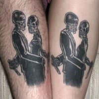 Blackwork style leg tattoo of skeleton couple