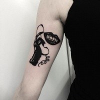 Blackwork style medium size biceps tattoo of vampire mouth with hand