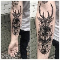 Blackwork style medium size forearm tattoo of various animals heads