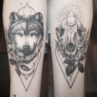 Blackwork style nice looking forearm tattoo of wolf skulls with flowers