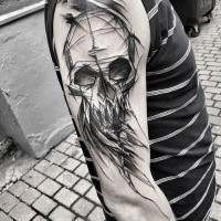 Blackwork style painted by Inez Janiak upper arm tattoo of demonic skull