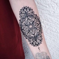 Blackwork style very detailed forearm tattoo of big ornamental flower