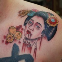 Bloody colored shoulder tattoo of Asian geisha severed head with coins